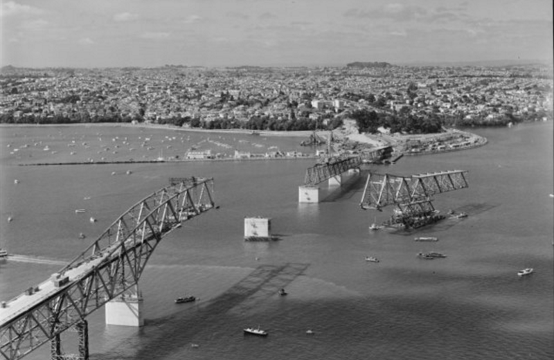 Auckland Harbour Bridge under construction. Whites Aviation Ltd :Photographs. Ref: WA-48833-G. Alexander Turnbull Library, Wellington, New Zealand